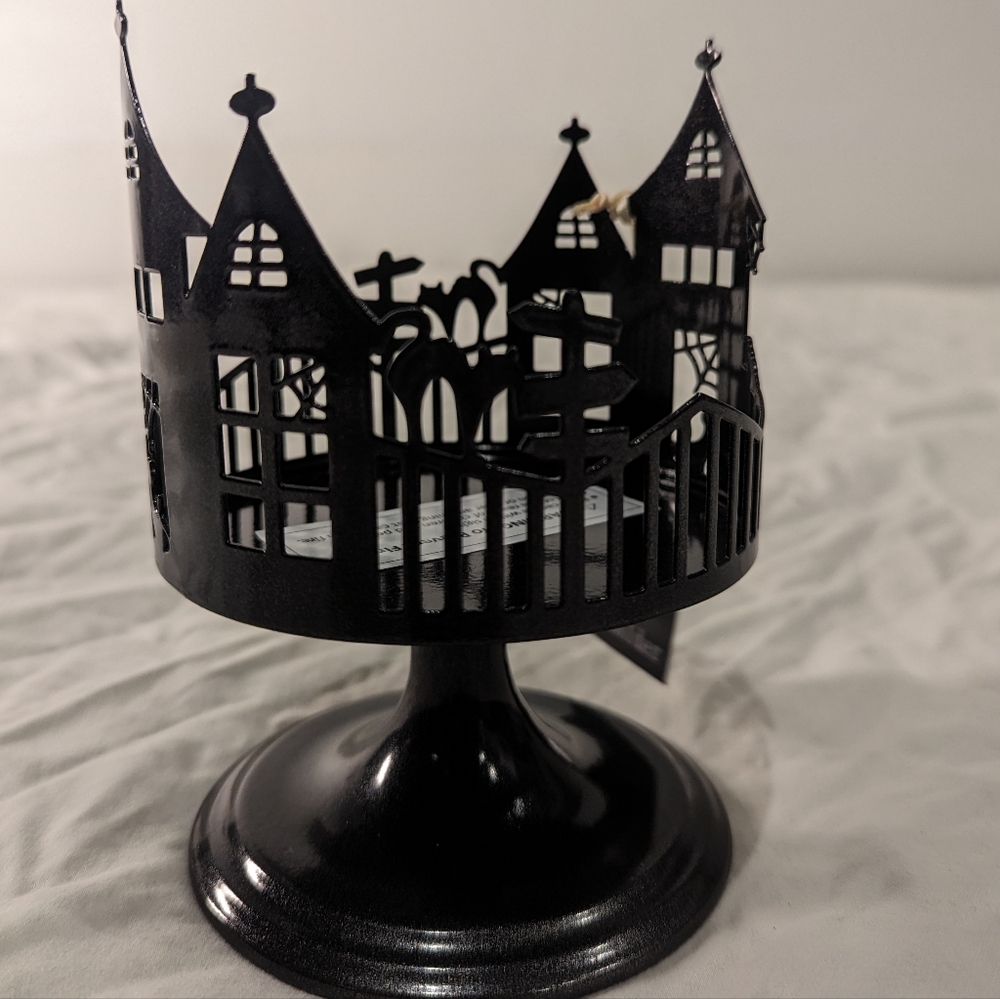 Haunted house candle holder